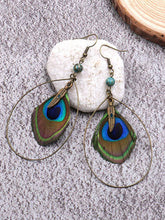Boucles d'oreilles en plumes de paon magnifiques
